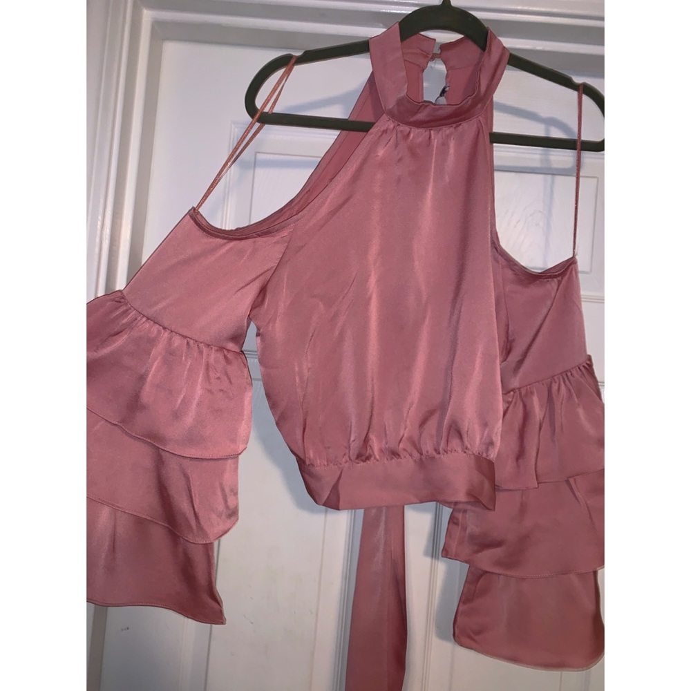 Open shoulder, ruffle sleeve pink blouse.